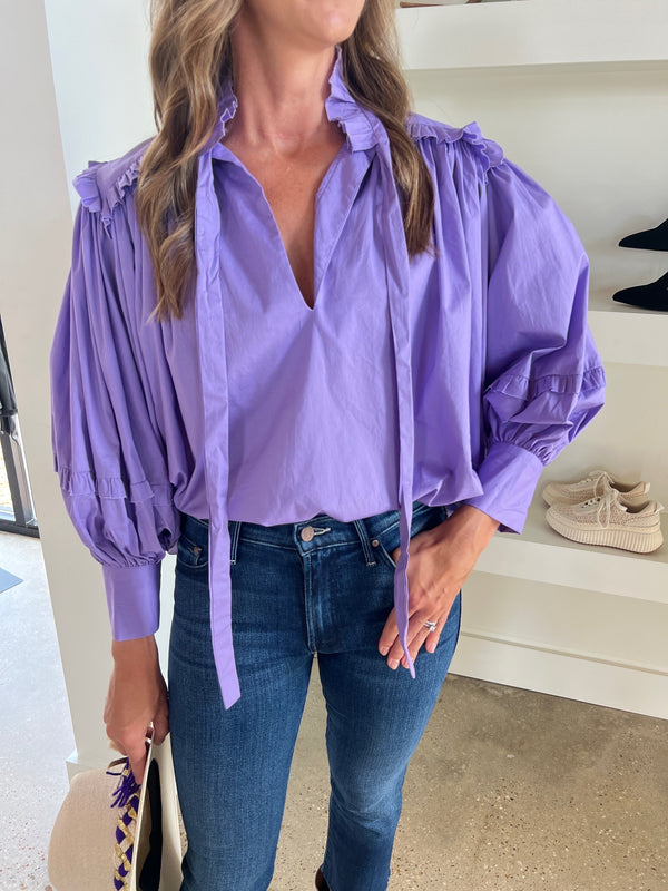 Purple Ruffle Poplin V-Neck Top by Karlie, a stylish and elegant top with pleated balloon sleeves and a tie at the neck.