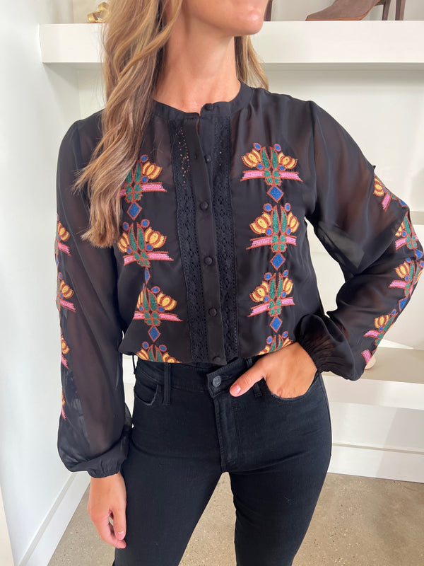 <p class="p1"><span>Black Malka Top by Allison, featuring sheer fabric with embroidery detail on front and sleeves, a stylish and elegant fashion piece.</span></p> <p class="p2">&nbsp;</p>